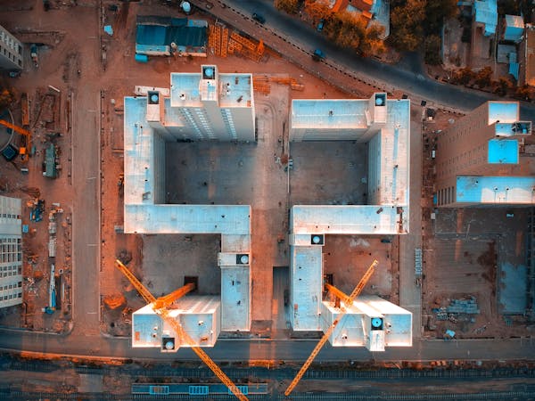 Side-by-side dashboards from multiple AI construction platforms running on Saudi mega-project footage